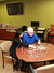 Male patient working on puzzle in activity room at Gwen Neilsen Anderson Rehabilitation Center