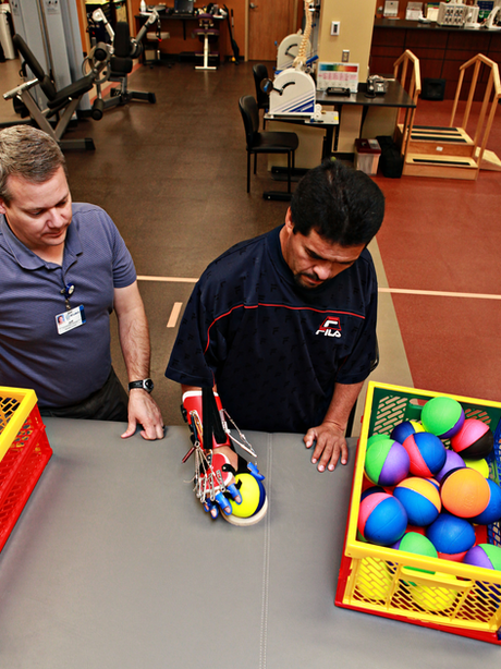 Patient using saebo hand system ball at Gwen Neilsen Anderson Rehabilitation Center