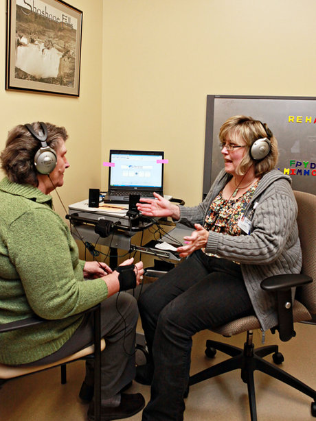 Speech therapist working with patient