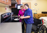 Patient at stove in transitional apartment at Gwen Neilsen Anderson Rehabilitation Center