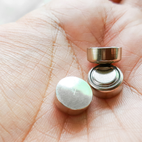 Button cell battery on hand