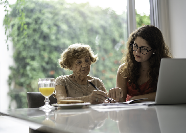 Patient and provider hold hands.
