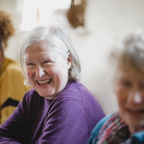 Woman in a group smiling