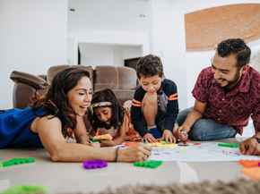 Young family hangoing out in livingroom