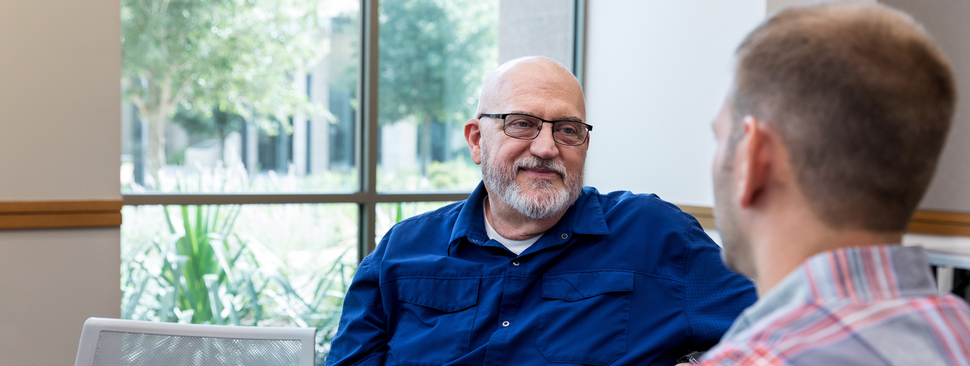 A man speaking to someone 