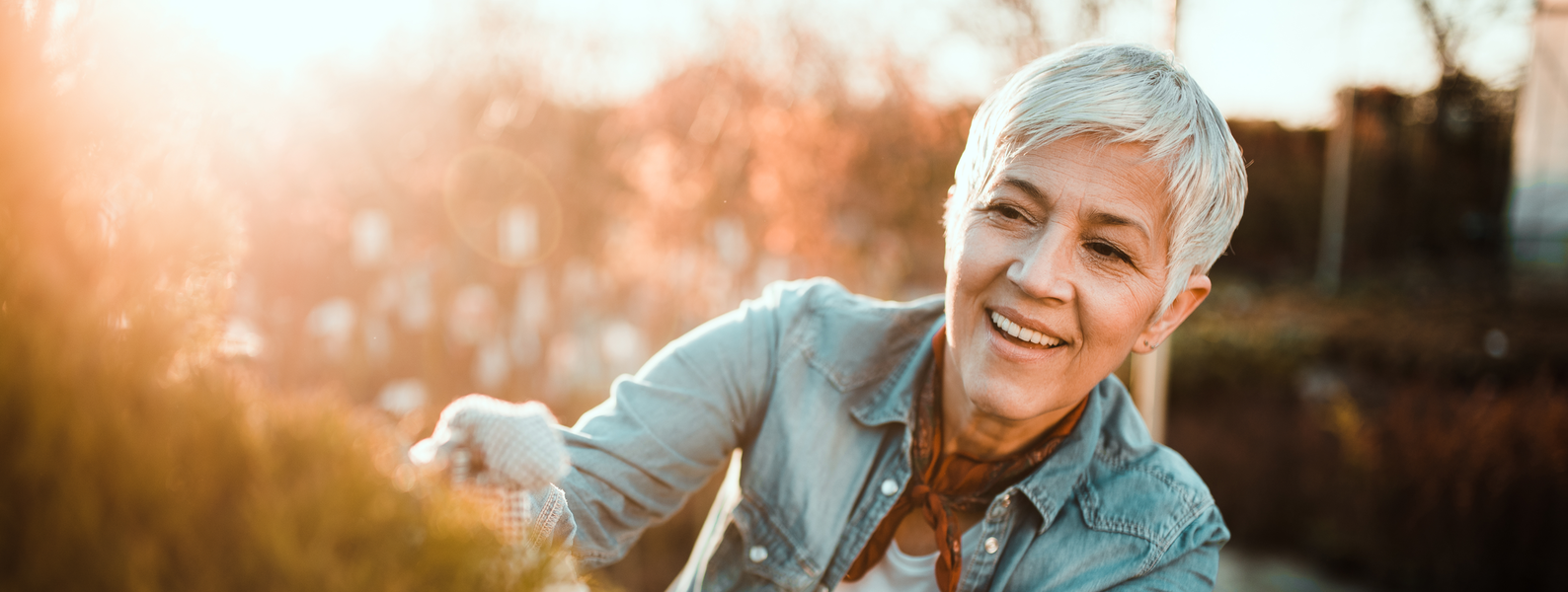Older woman gardening outside
