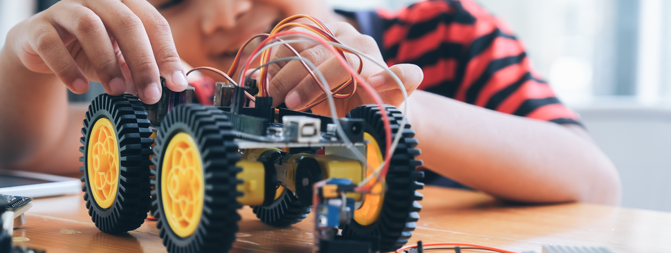 Child playing with a truck toy