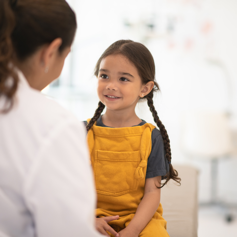 Girl receiving check up with the doctor