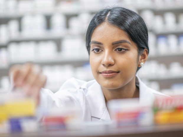 Young pharmacy resident at work.