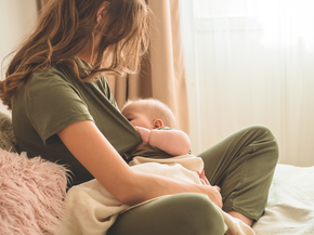 Portrait of mom and breastfeeding baby