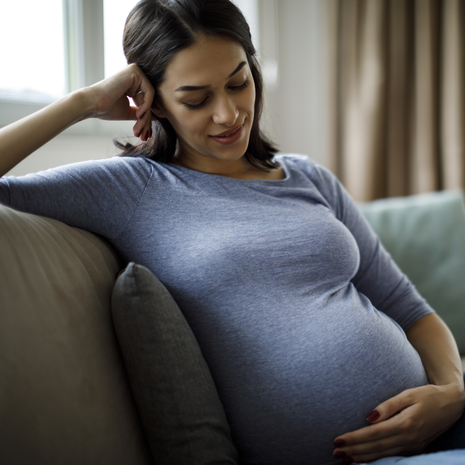 pregnant woman calmly smiling