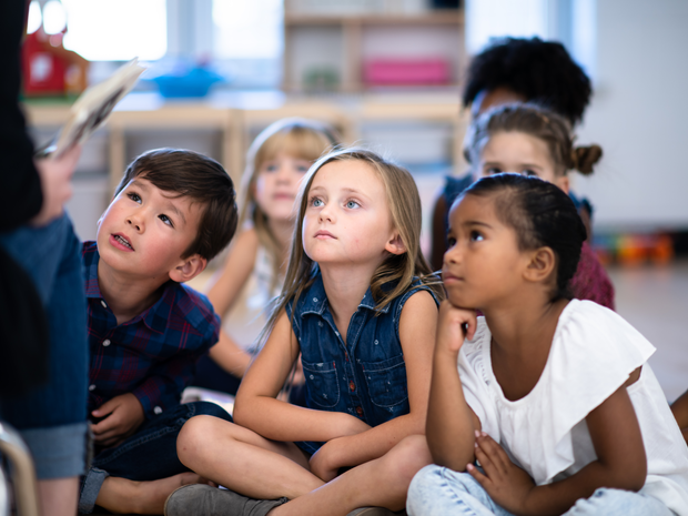 school kids listening to a presentation