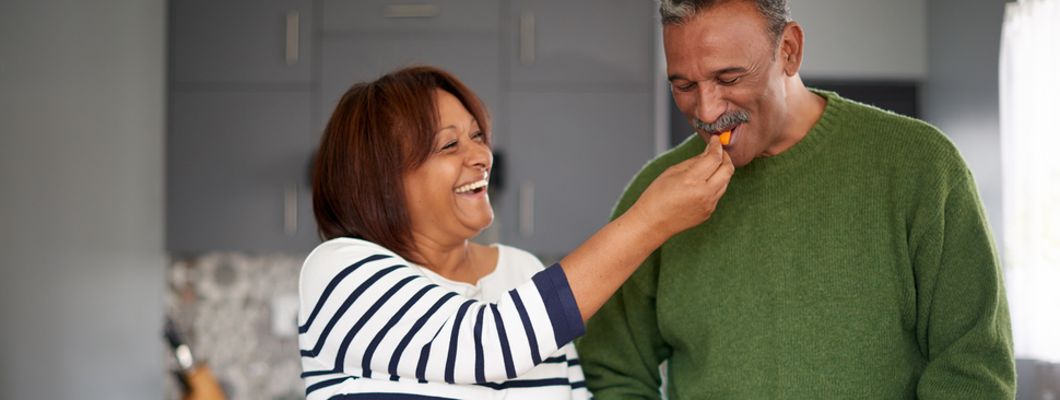 mature couple cooking a healthy meal together