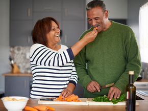 a couple making a healthy meal together 