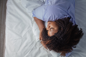 Woman sleeping in bed. 