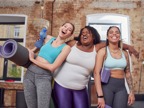 Women smile at yoga