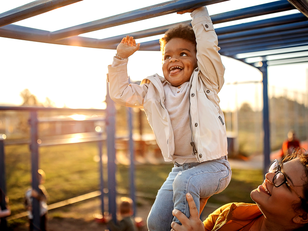 Young boy smiles on playground