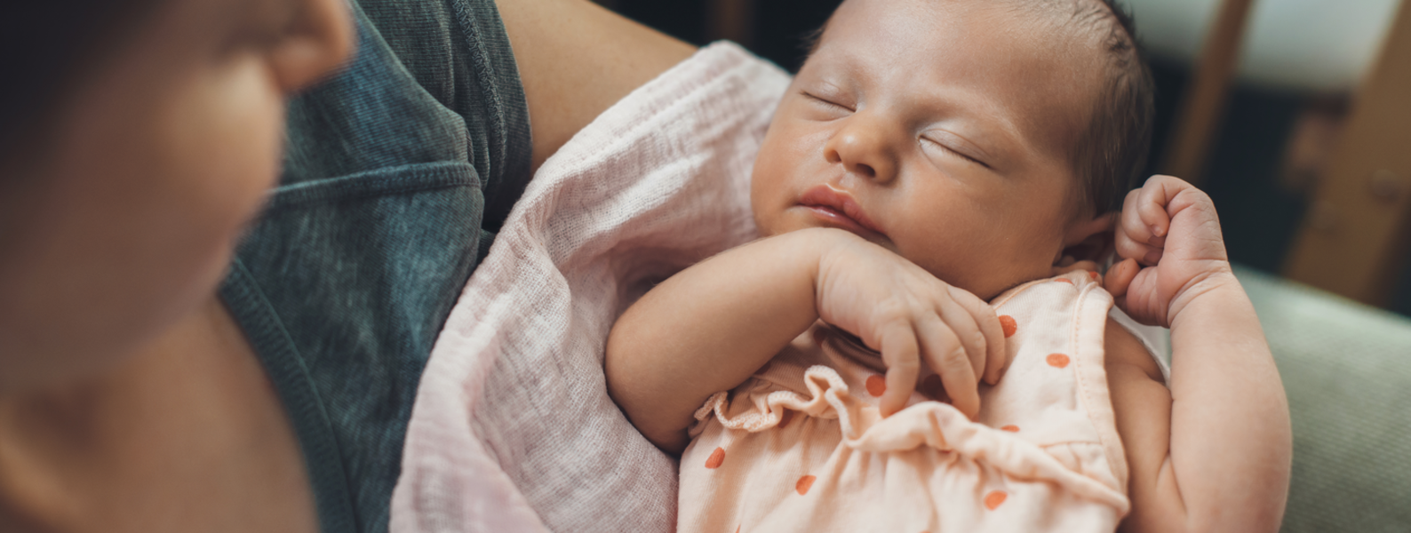 A mother holding a newborn