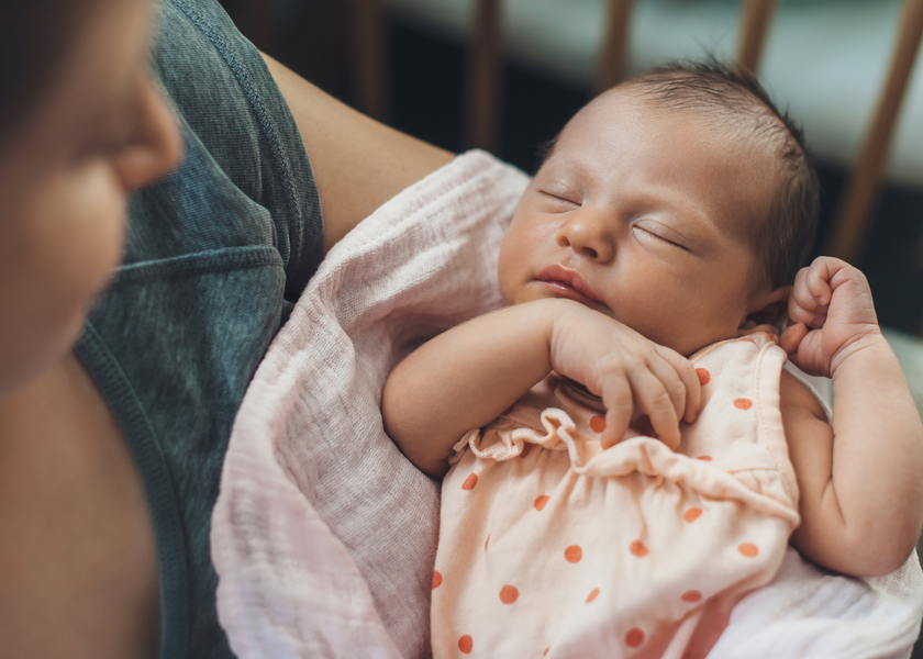 A mother holding a newborn