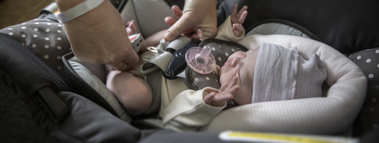 A car seat being buckled