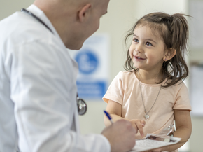 Young patient smiling at doctor