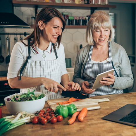 two women cooking together