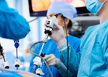 A group of surgeons at work in an operating room