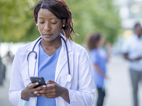 Doctor on mobile phone.