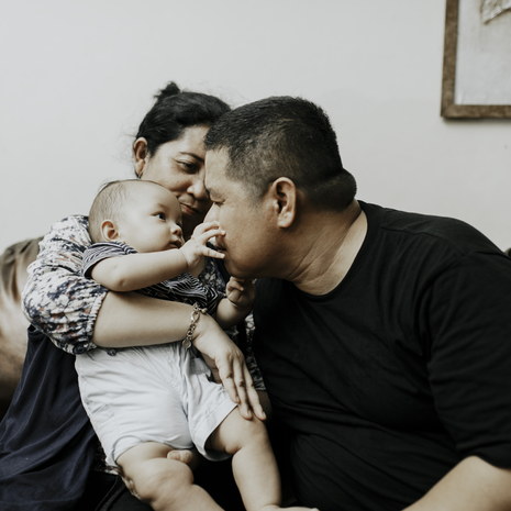 Family playing with baby