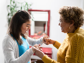young woman checking an older woman's balance