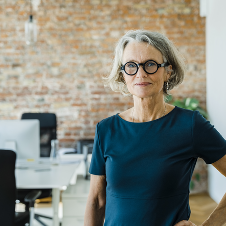 Portrait of a senior woman standing in office