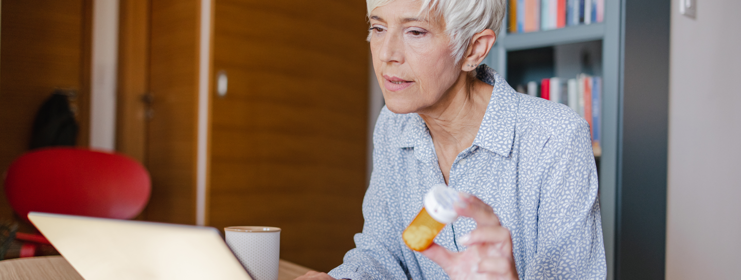 Woman holding a tablet.