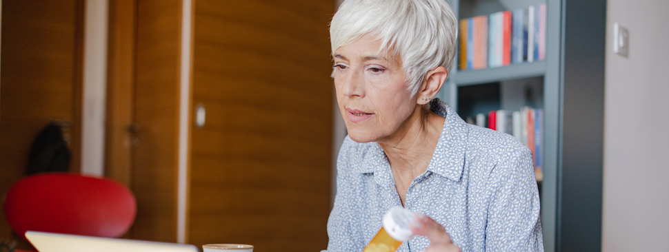 Woman holding a tablet.