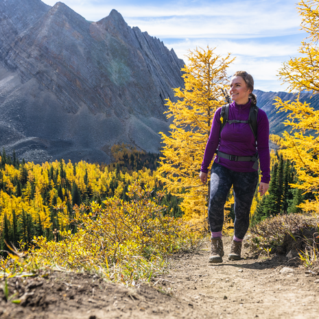 Woman hiking a mountain trail