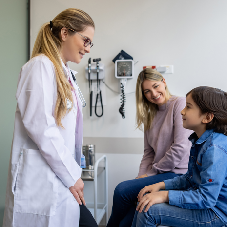 mom and son with doctor