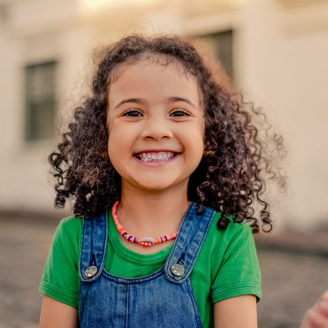 young girl smiling outside