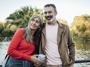 Happy couple standing outside