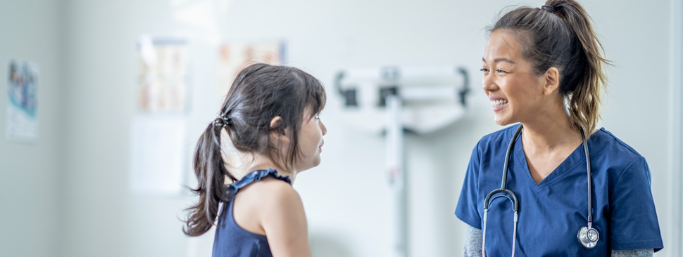 Doctor and child patient in a doctor's office.