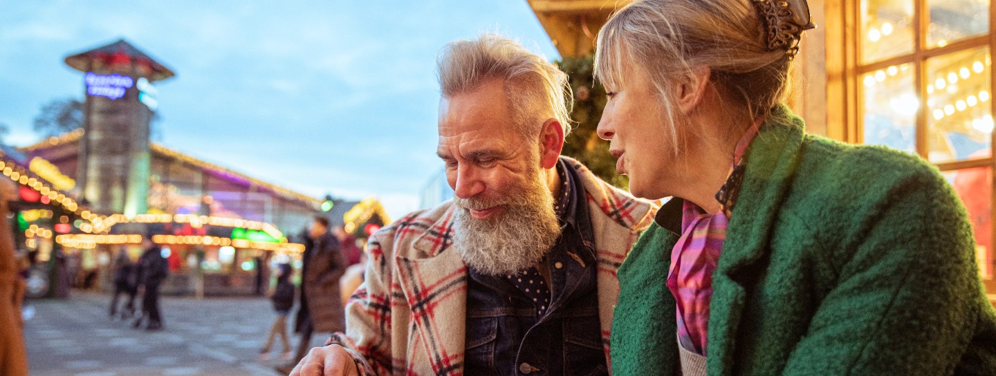 Senior couple enjoying street food