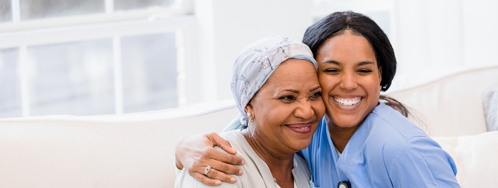 Nurse hugging a patient.