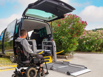 Accessible car with wheelchair lift ramp for person with disability
