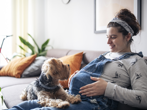 A pregnant woman on a couch