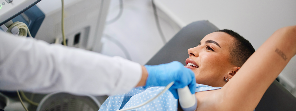 Breast cancer survivor smiles outdoors