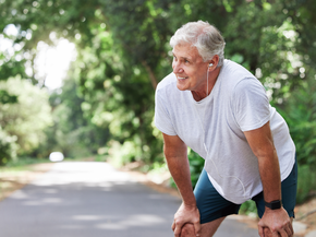 An older man smiles after working out