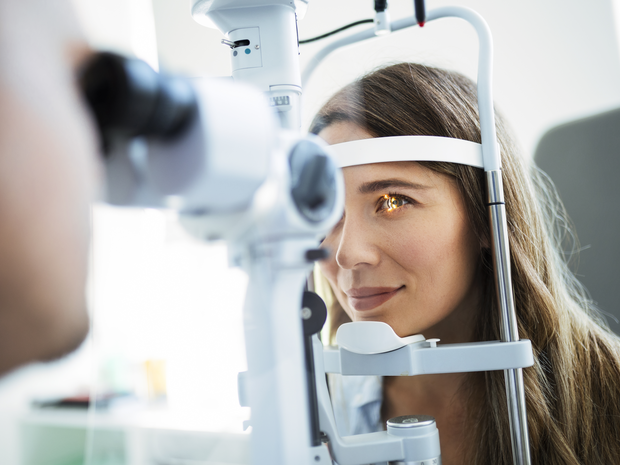 woman undergoes eye exam