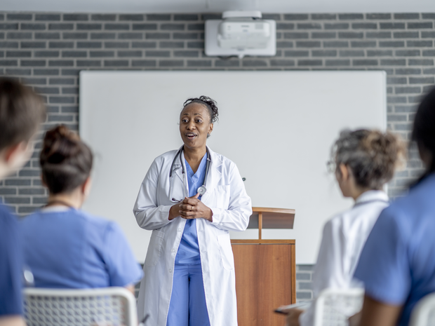Medical instructor speaking to classroom of her students