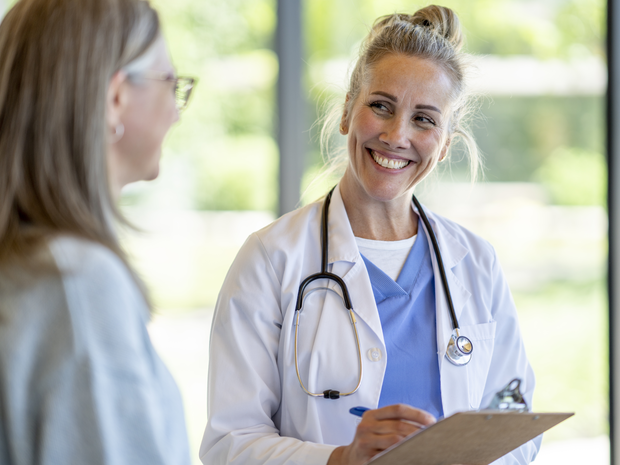 A doctor and patient sit to have a discussion