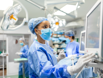 Woman surgeon in operating room.