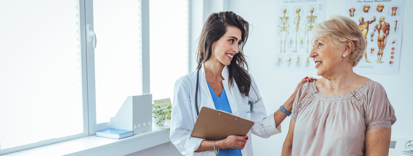 Senior woman discussing health issues with a health care professional
