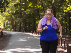 woman exercising on a park path